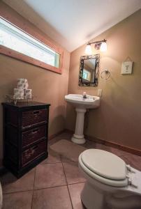 a bathroom with a toilet and a sink at Hawks Peak - by The Chalets in Logan +26 photos
