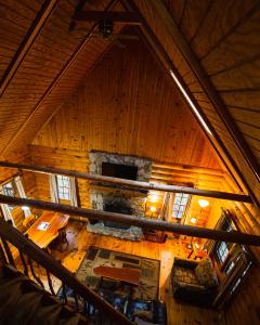 an overhead view of a fireplace in a log cabin at Pioneer - by The Chalets in South Bloomingville