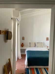 Ένα ή περισσότερα κρεβάτια σε δωμάτιο στο Casa das Ameixas