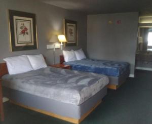 a hotel room with two beds in a room at 2 Double Beds Hotel Studio 135 in Livingston