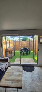 a room with a view of a patio with a table at Appartement Ychoux in Ychoux