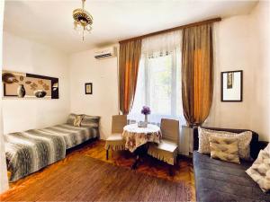 a living room with a couch and a table at Apartment Rustico Belgrade in Belgrade