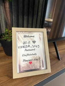a sign that is on top of a table at West Point Luxury studio in Plovdiv +15 photos