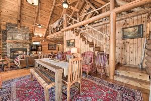 a dining room with a table and chairs in a cabin at Trout Lodge at Two Rivers-White River Cabin in Norfork