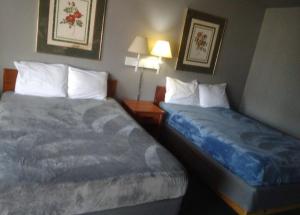 Postel nebo postele na pokoji v ubytování King Beds Hotel Studio 136 + 3 fotografie