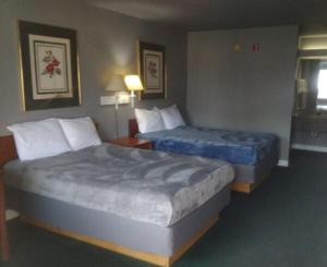 Postel nebo postele na pokoji v ubytování King Beds Hotel Studio 136