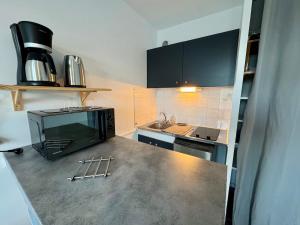 Un televizor și/sau centru de divertisment la Appartement Cosy dans le Centre