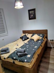 a bedroom with a bed with stars on it at Apartman Nada in Jagodina