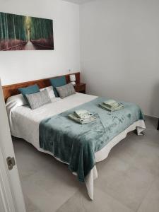 Ein Bett oder Betten in einem Zimmer der Unterkunft Cala Ferrera HOME&ME