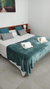 Ein Bett oder Betten in einem Zimmer der Unterkunft Cala Ferrera HOME&ME
