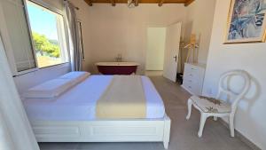A bed or beds in a room at Koukouapartments & Suites