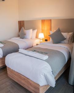 Postel nebo postele na pokoji v ubytování Las palmas resort + 27 fotografií
