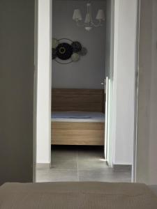 A bed or beds in a room at Koukouapartments & Suites