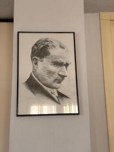 a black and white picture of a man on a wall at Milas-Bodrum Özel Havuzlu Triplex Villa in Milas +57 photos