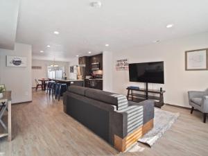 a living room with a couch and a tv in it at 1mile To Arenagonzagaetc Wd, Off St Parking in Spokane