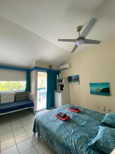 Llit o llits en una habitació de CoCoKreyol - Ti CARAYOU