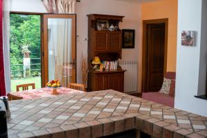 a room with a table with a bowl of fruit on it at Collina e mare in Camogli