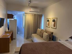 Ένα ή περισσότερα κρεβάτια σε δωμάτιο στο Bahia Flat Barra - Frente mar