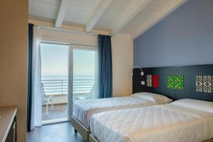 Postel nebo postele na pokoji v ubytování Villa Primaguadia + 37 fotografií
