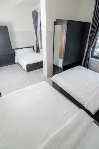 Postel nebo postele na pokoji v ubytování Hotel Leonda-gần chợ đêm-near the night market