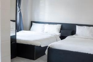 Postel nebo postele na pokoji v ubytování Hotel Leonda-gần chợ đêm-near the night market