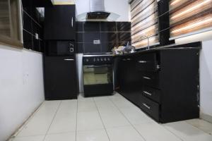 Kuchyň nebo kuchyňský kout v ubytování Serviced Apartment Direct