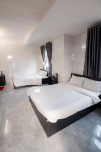 Postel nebo postele na pokoji v ubytování Hotel Leonda-gần chợ đêm-near the night market