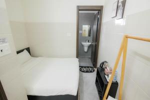 Postel nebo postele na pokoji v ubytování Hotel Leonda-gần chợ đêm-near the night market
