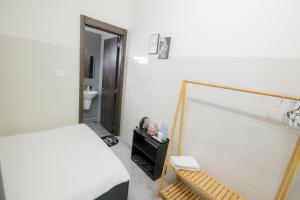 Postel nebo postele na pokoji v ubytování Hotel Leonda-gần chợ đêm-near the night market