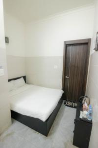 Postel nebo postele na pokoji v ubytování Hotel Leonda-gần chợ đêm-near the night market