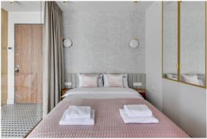 Posteľ alebo postele v izbe v ubytovaní Prestige Apart Gdańsk