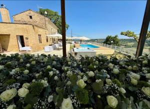 a bunch of flowers in front of a house at Za Teresa - Napoleonic Private Resort & Spa - Entire property only in Giuliano Teatino