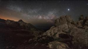 a starry night with the milky way over the mountains at Wooden House at the Mountain-private in Paránimfoi