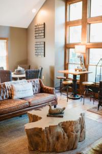 a living room with a couch and a table at Getaway Inn at Cooper's Woods in Put-in-Bay +51 photos