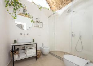 a bathroom with a shower and a toilet and a sink at Dimora Storica Villa Pasquale Capri in Capri