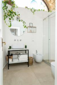 a bathroom with a sink and a mirror at Dimora Storica Villa Pasquale Capri in Capri +37 photos