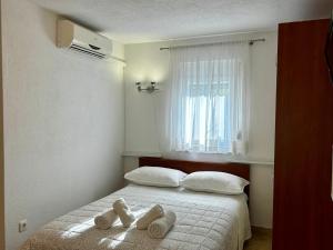 Posteľ alebo postele v izbe v ubytovaní Dinka Apartment