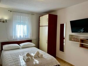 Posteľ alebo postele v izbe v ubytovaní Dinka Apartment
