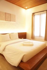 Postel nebo postele na pokoji v ubytování Lantis ViBES Inn