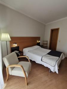 Cama ou camas em um quarto em Hotel Covilhã Jardim