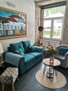 Uma área de estar em Hotel Covilhã Jardim
