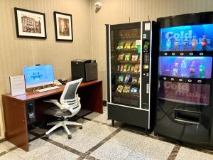 an office with a desk with a computer and a refrigerator at Heritage Hotel New York City in New York