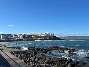 a view of the ocean from a rocky beach at Atlantic Port Retreat in Portstewart