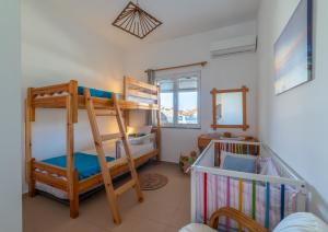 Postel nebo postele na pokoji v ubytování Golden Shellseaside
