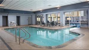 a large pool with blue water in a building at StripViewSuites at Platinum in Las Vegas