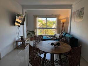 a living room with a table and a couch at Amané - Alquiler temporal con estilo en Posadas in Posadas