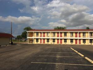 an empty parking lot in front of a building at Alice Motor Inn in Alice