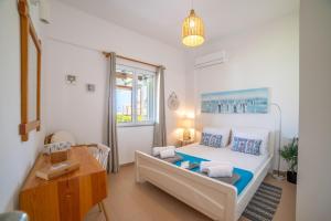 Postel nebo postele na pokoji v ubytování Golden Shellseaside
