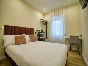Postel nebo postele na pokoji v ubytování Gioia Guest House