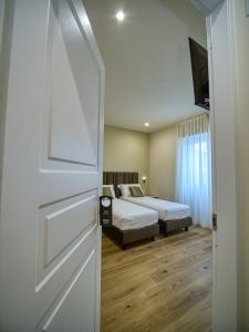 Postel nebo postele na pokoji v ubytování Gioia Guest House